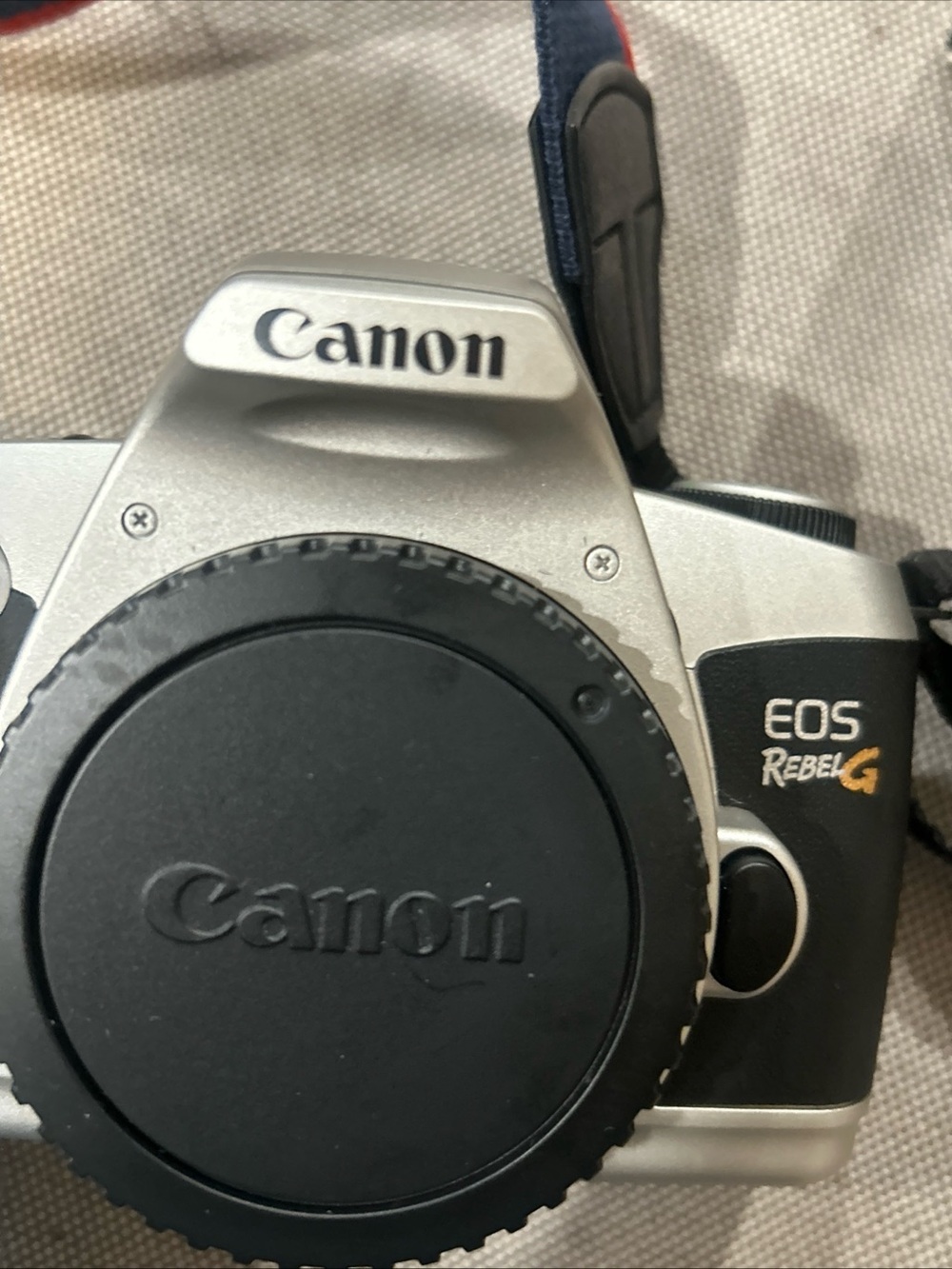 Canon EOS Rebel G Silver and Black Film SLR with Blue and Red Canon Strap - Picture 2 of 5